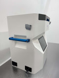 Front-left view of the VIA Freeze Quad showing the blue side handle and angled touchscreen.