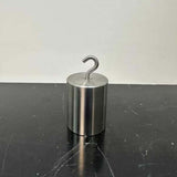 High-precision 1kg stainless steel hook weight used for LOVO system calibration.