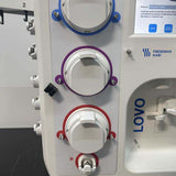 Close-up of the three primary peristaltic pump heads (blue, purple, red) on the Fresenius Kabi LOVO unit.