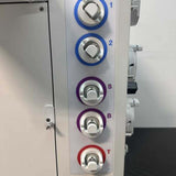 Close-up of color-coded dials 1, 2, S, B, and T on the Fresenius Kabi LOVO system.